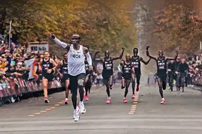 Shoes help Kipchoge smash barrier