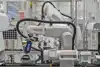 Robot-aided cementing of uppers and soles