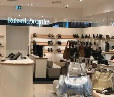 Next acquires Russell & Bromley